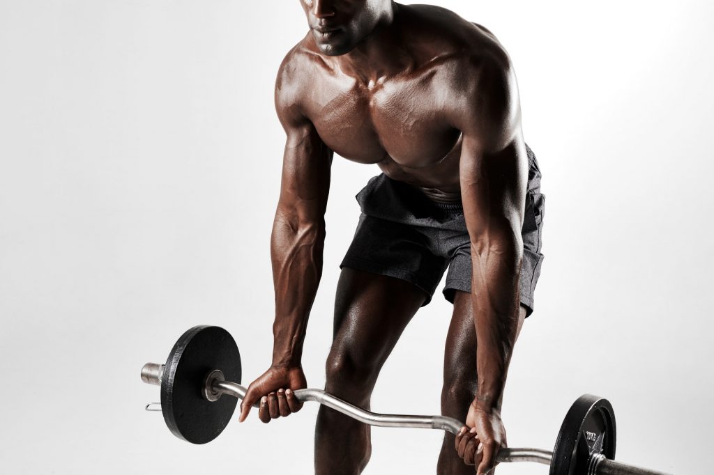 Male bodybuilder exercising with a barbell